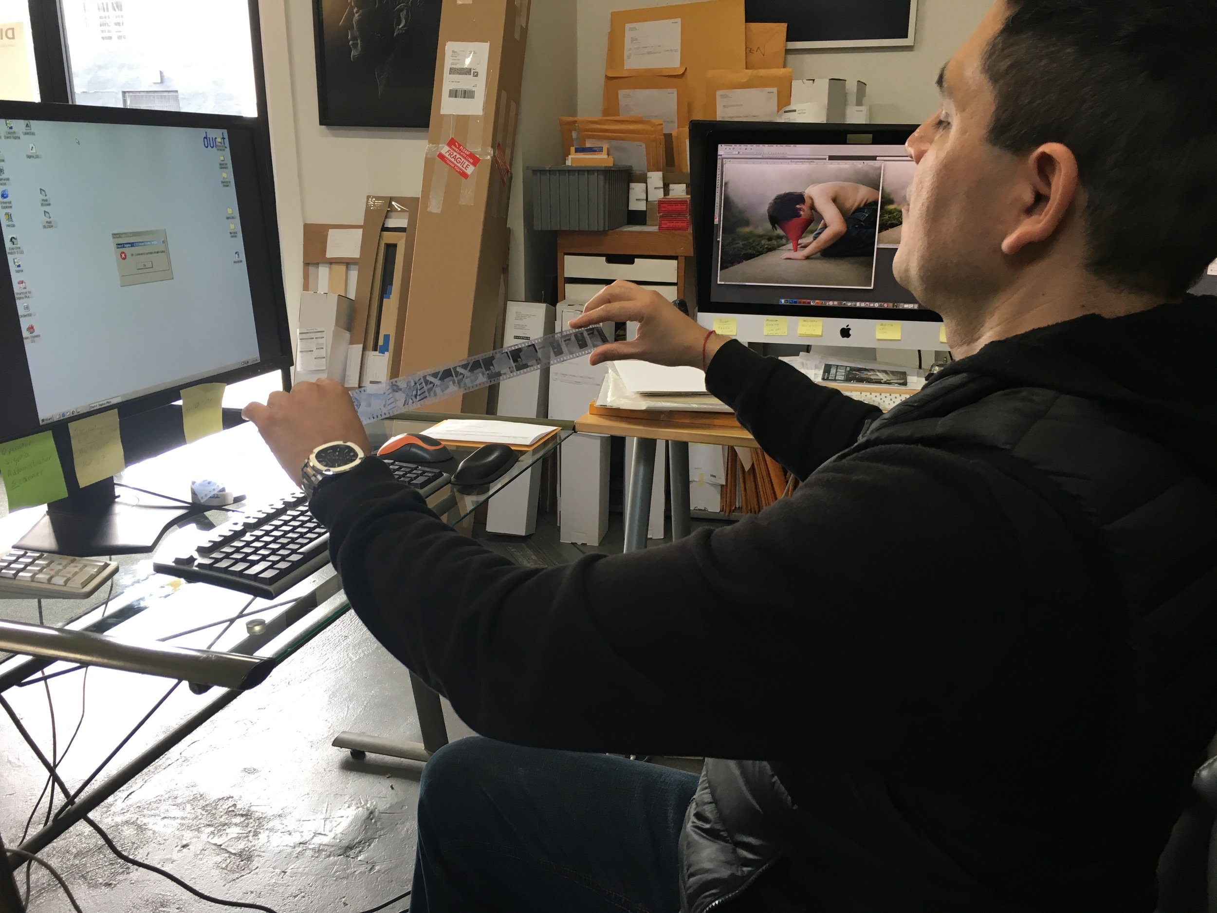  Gabriel prepares to scan a roll of film in our  Durst Sigma Plus  scanner. 