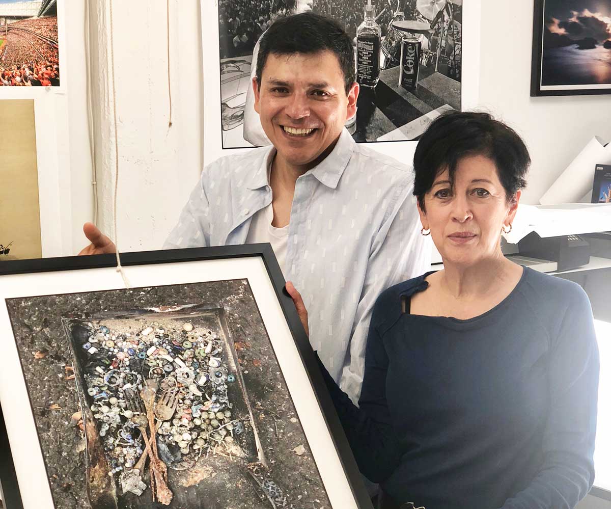  Gabriel Aguilar and Norma Quintana with a framed print from Forage From Fire. 