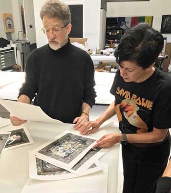  Seth Dickerman and Norma Quintana go through Forage From Fire test prints. 