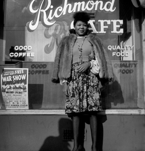 Woman standing in front of Richmond Cafe - Photo by Dorothea Lange. Printed by Seth Dickerman 